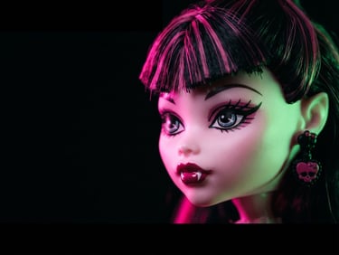 Macro shot of a Monster High G1 doll's face, high-contrast dark background, neon pink and green rim lighting, sharp focus, 35mm, wide panoramic, off-center to the right.