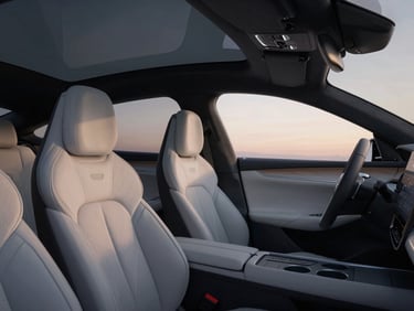 Interior of a sleek modern luxury sedan, soft twilight lighting, clean leather seats, minimal dashboard details