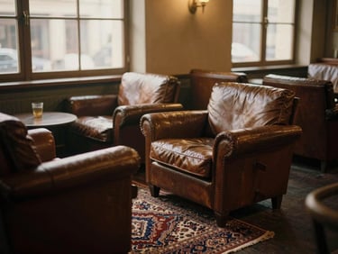 Cozy vintage lounge area with leather armchairs, Persian rug, and dimmed lighting, atmospheric shot