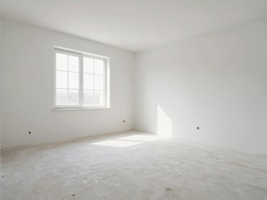 Wide-angle architectural interior shot of a freshly renovated room, sharp clean drywall lines, bright natural daylight coming from a window, spotless floor.