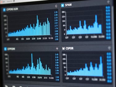 High-contrast terminal interface showing system resource monitoring, CPU load graphs, slate gray background, electric blue data highlights, sharp focus