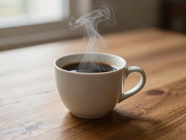 Steaming cup of specialty coffee on a wooden table, soft morning light, shallow depth of field, ceramic mug.