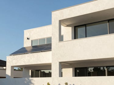 Bright architectural photography of a modern San Diego home exterior, showcasing crisp stucco lines and clean solar panel integration under clear afternoon sky