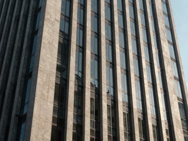 Close architectural view of a Thonglor high-rise facade at midday, concrete and glass geometry catching sharp north-facing daylight, shadows defining structural depth, no people, wide landscape crop