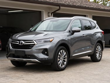 Realistic unedited outdoor photo of a grey family SUV parked in the garage lot, natural daylight, clean paint, realistic details.
