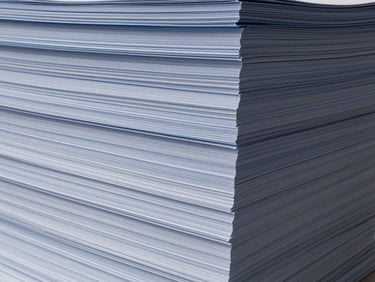 Abstract image of stacked financial documents or ledgers, clean and organized, with subtle architectural lighting.