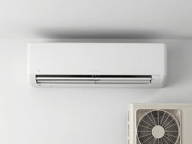 A straight-on medium shot of a clean, modern indoor wall air-conditioning unit mounted on a white wall, paired with its outdoor compressor, bright utility lighting, no people.