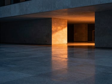 Abstract light patterns reflecting off a polished concrete floor in a modern corporate lobby, sharp architectural lines, cool tones with a warm orange light leak, 35mm lens.