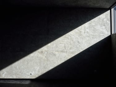 Architectural detail of a modern concrete boardroom corner with sharp geometric shadows and low-key lighting, high-contrast, editorial 35mm film.