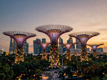 Cinematic wide-angle shot of modern Singapore skyline at dusk, glowing supertrees, warm ambient city lights.