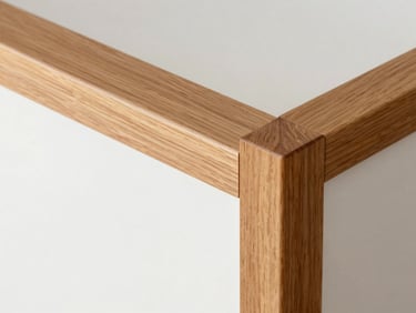 A close-up of custom-milled wood finishes, grain-matched joints, warm amber tones, clean architectural lines, bright natural lighting.