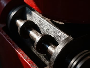 Extreme macro detail of heavy industrial machinery, dramatic shadows, sharp directional light, crimson accents