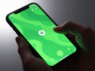 Extreme close-up of hands interacting with a modern Android phone displaying a vibrant, fluid mobile game with neon green UI elements, sharp focus on screen edges, studio backlighting, bleeding to the left.