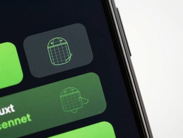 Close-up macro shot of a modern Android device displaying a clean, geometric utility app interface with subtle neon green accents and wireframe diagrams, dynamic diagonal framing, studio backlighting, bleeding to the right.