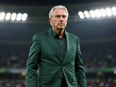 Candid portrait of a senior sports journalist in a dark green blazer, sharp studio lighting, neutral dark background, professional and authoritative.