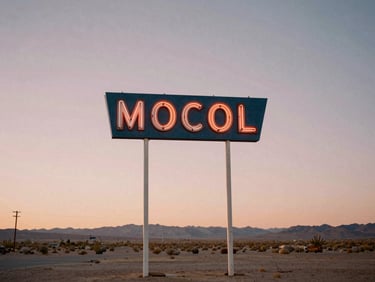 Vintage neon motel sign standing against a pastel twilight sky in the desert, nostalgic Americana style, 35mm film look
