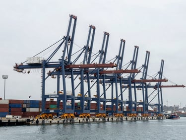 Wide environmental shot of the modern Chancay port terminal under construction, massive container cranes, deepwater berths, overcast daylight, cool steel tones, industrial maritime photography