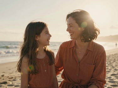 Candid mid-shot of a mother and daughter laughing on a beach, warm backlighting, soft natural flares, authentic family interaction