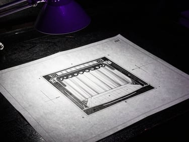 Gritty close-up of a stage blueprint on a dark table under a purple work lamp, high-contrast