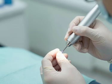 Dentist applying a tooth-colored filling, high-tech curing light, focus on the tooth, sterile environment.