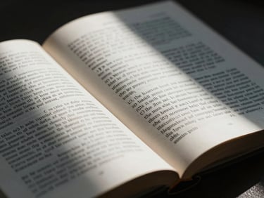 Macro photography of an open Indian law book, focusing on printed legal text with dramatic side-lighting and deep shadows, 35mm.