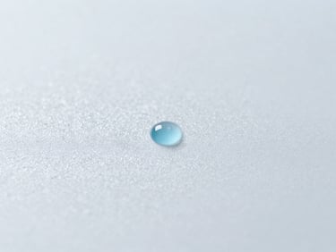 Macro shot of ice crystals on a sterile surface, with a faint blue liquid droplet, bright clinical lighting.
