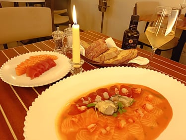 Carpaccio di salmone con ostriche e crostacei servito al ristorante Sant’Andrea