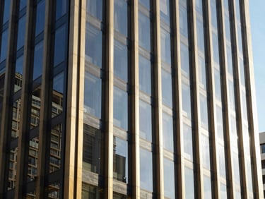 Architectural detail of a contemporary Australian business district building facade, reflective glass, bright natural daylight, conveying corporate professionalism.