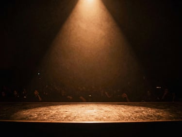 Atmospheric wide shot of an empty dive bar stage before a show, warm tungsten glow from a single spotlight, moody shadows