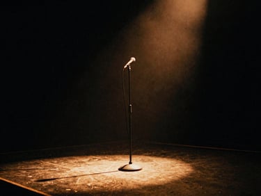 An empty dive bar stage with a single microphone stand under a warm spotlight, moody shadows, 35mm film grain