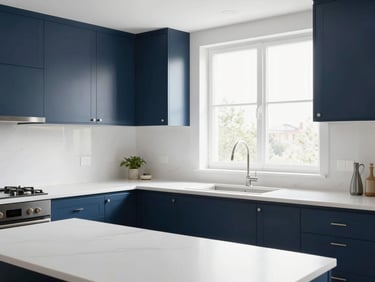 Bright modern kitchen remodel with clean white countertops, navy blue cabinets, and high-key natural daylight flooding through a window.