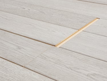 Close-up of premium white oak engineered hardwood flooring joint, perfect alignment, clean architectural lines