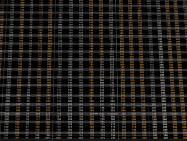 Stark digital rendering of a data matrix displaying predictive baseline values, monochromatic with tactical amber highlights, orthographic view.
