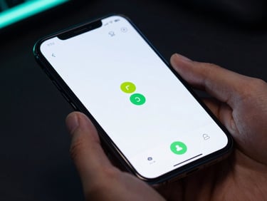 Macro close-up of hands holding an Android phone in a dark room with subtle neon glows, displaying a clean, high-contrast utility app with green indicators.