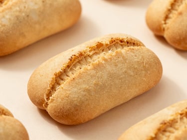 Clean packaged food products on a neutral light background, professional food photography.