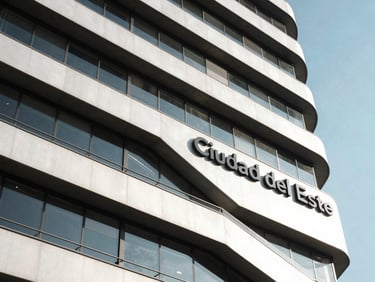 Bright architectural detail of a modern corporate building facade in Ciudad del Este under clean midday sunlight.