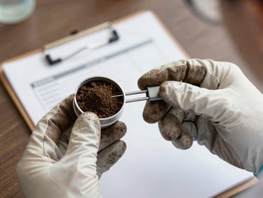 Close-up of scientist hands in leather gloves holding a soil core sampler, extracting a clean soil profile under soft daylight, field clipboard in background