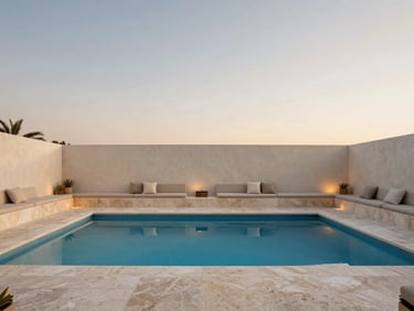 Minimalist outdoor living space with a clean-lined pool, integrated seating, and subtle landscape lighting at twilight, South Florida resort, wide-angle lens, 35mm
