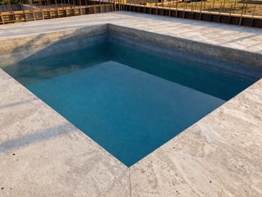 View from inside a partially constructed concrete pool, showing rebar and formwork, with light filtering in, clean and precise, 35mm