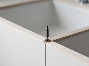 Close-up of precise tool alignment on a clean wooden joint, minimalist interior photography, sharp focus, 35mm