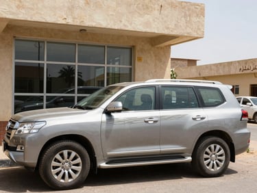 A modern SUV parked outside an office building in Sudan, bright daylight, clear reflections