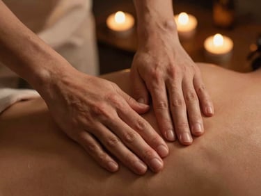 Hands performing a gentle massage on a shoulder using warm herbal oil, low-key candlelit atmosphere, 35mm