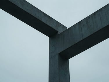 Abstract architectural geometry with sharp lines and concrete structures, cool diffused studio light, subtle teal accents, 35mm