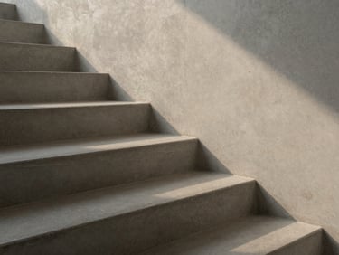 Close-up of concrete stairs with hard diagonal shadows from soft evening sun, minimalist composition, neutral muted tones, high contrast.