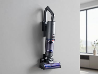 A sleek cordless vacuum cleaner mounted on a neutral grey wall in a modern utility room
