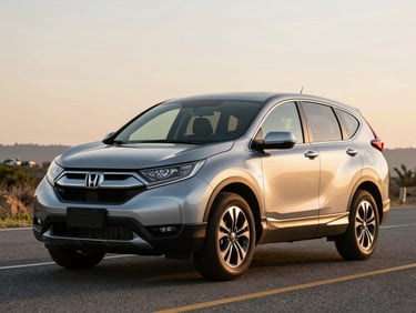 Three-quarter exterior of a silver Honda CR-V on an open Cayman road at golden hour, full vehicle profile, warm natural light revealing bodywork condition