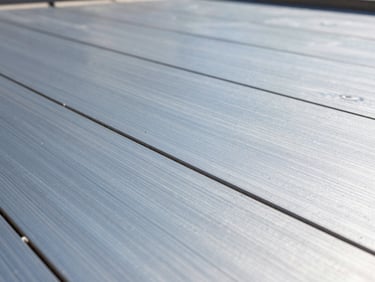 Macro detail of raised access flooring being installed, showing the sub-floor structure and precise alignment, crisp daylight, cool blue and steel gray tones, high-contrast architectural photography.