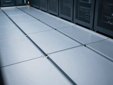 Clean close-up of a modern raised access flooring system in a server room, showing modular panels and sub-floor integration, crisp cool-toned architectural lighting.