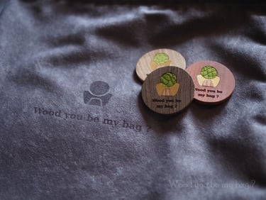 round wooden business cards with Wood you be my bag? brad logo