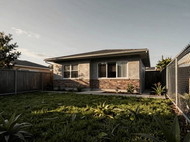 High-contrast architectural render of a neglected suburban backyard, overgrown turf, chain-link fence, flat overcast daylight, 35mm